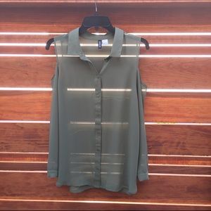 Semi-sheer long-sleeved olive green blouse.