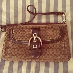Brown leather and canvas coach wristlet