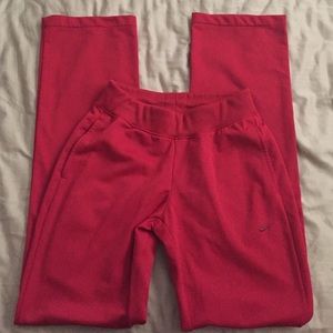 Red Nike workout pants