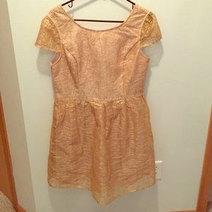 Gold mid-length dress.