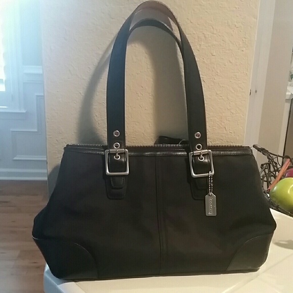 Black, fabric Coach handbag.