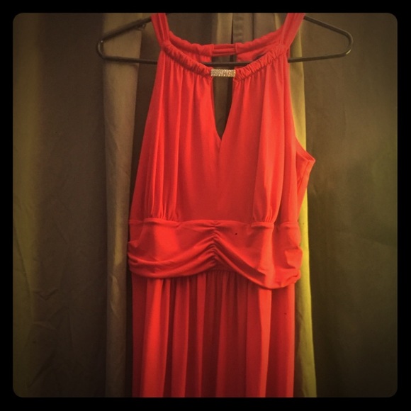 Long red/orange dress.