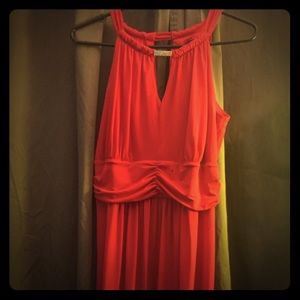 Long red/orange dress.