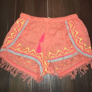 Bright orange/coral shorts with designs