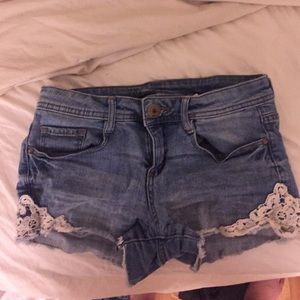 Denim shorts with white lace detailing