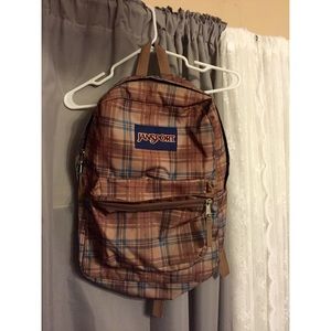Brown plaid Jansport backpack.