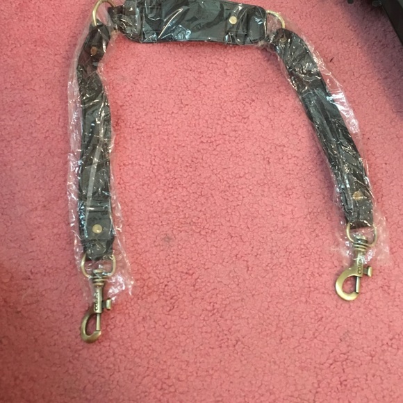 Had a extra coach black long strap for a bag