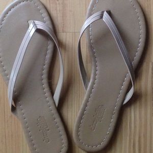 Tan flip flops