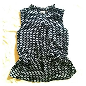 Navy blue and white sleeveless blouse
