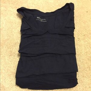 Short sleeve navy ruffled shirt.