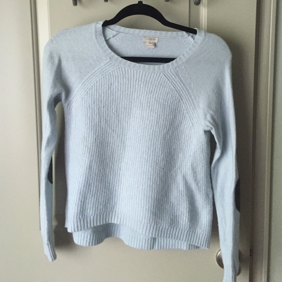 Light blue sweater with black leather shoulders