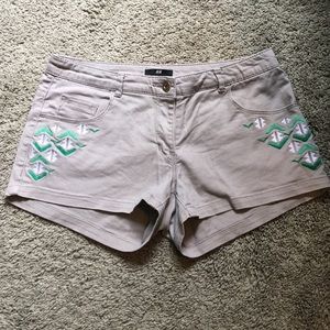 Khaki shorts with green/ white details