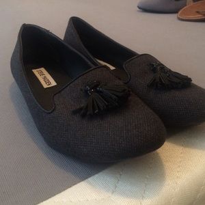 Black tasseled loafers