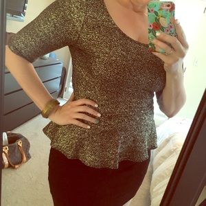 Peplum top in black and gold foil