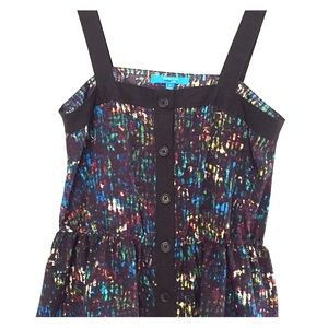 Button down tank with elastic fitted waist.