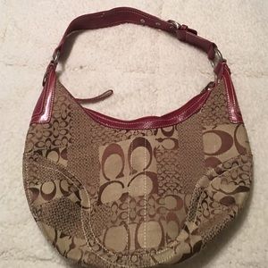 Coach handbag. Signature print in tan with red.