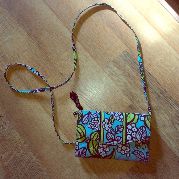 Vera Bradley wallet with cross body attachment.
