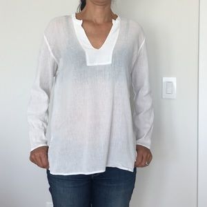 White v-neck blouse.