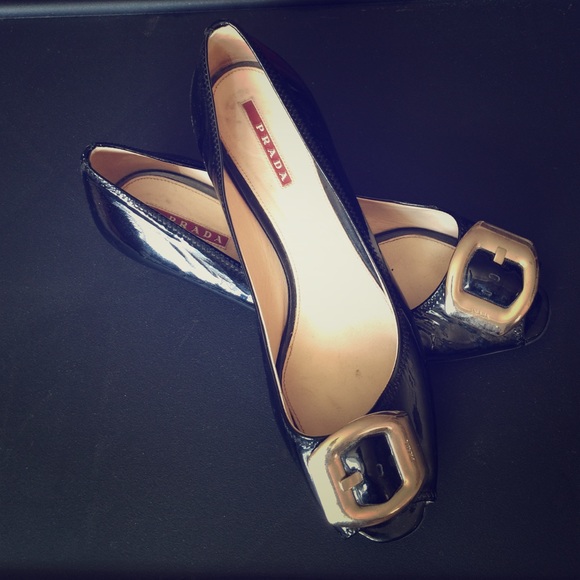 Black patent leather Prada shoes.