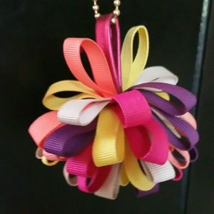 COACH POPPY POMPOM HANGTAG