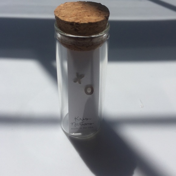 Minimalist Kris Nations "X O" earrings.