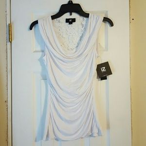 NWT* White sleeveless ruched shirt.