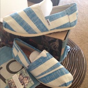 Brand new Toms. Blue and white stripe.