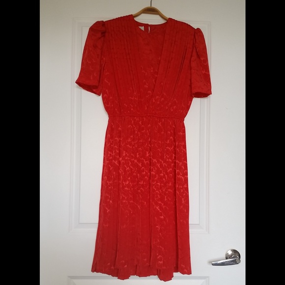 Monica Richards red dress with pleated