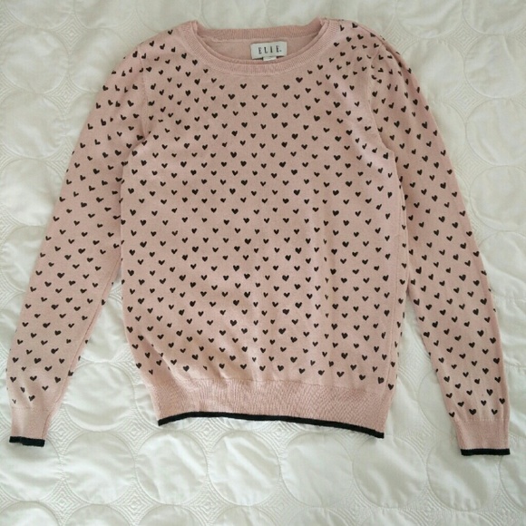 Delicate pink sweater with black hearts
