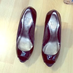 Pelle Moda patent peep toe pumps