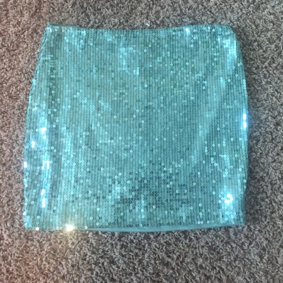 Sparkly green mini skirt.