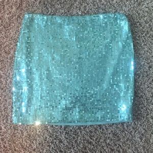 Sparkly green mini skirt.