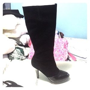 Black leather high heeled boots