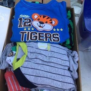 Bundle of newborn boy sleepers.