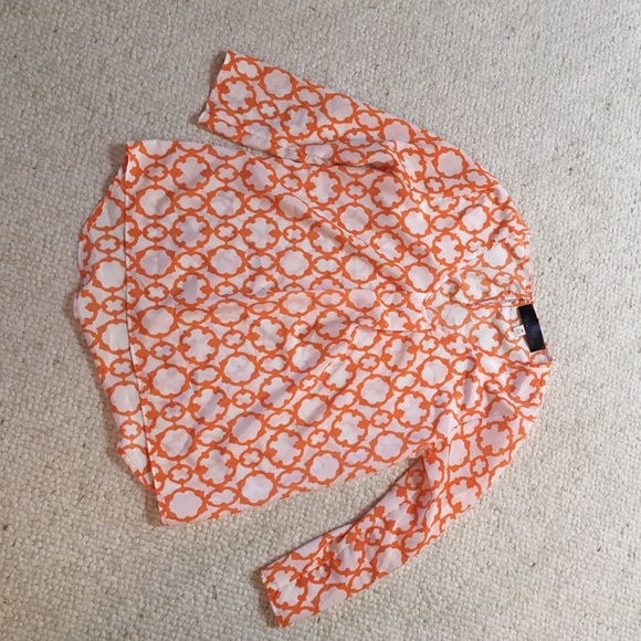 Orange and white long sleeved top