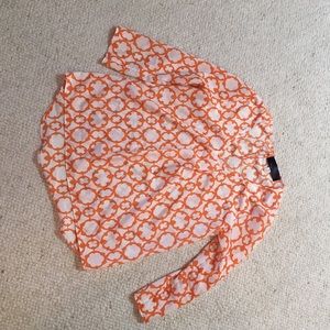 Orange and white long sleeved top
