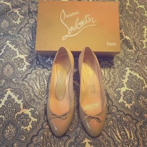 Christian Louboutins shoe with bow