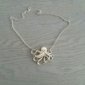 Silver tone octopus necklace.