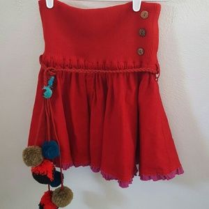 Free people red corduroy skirt with pom poms