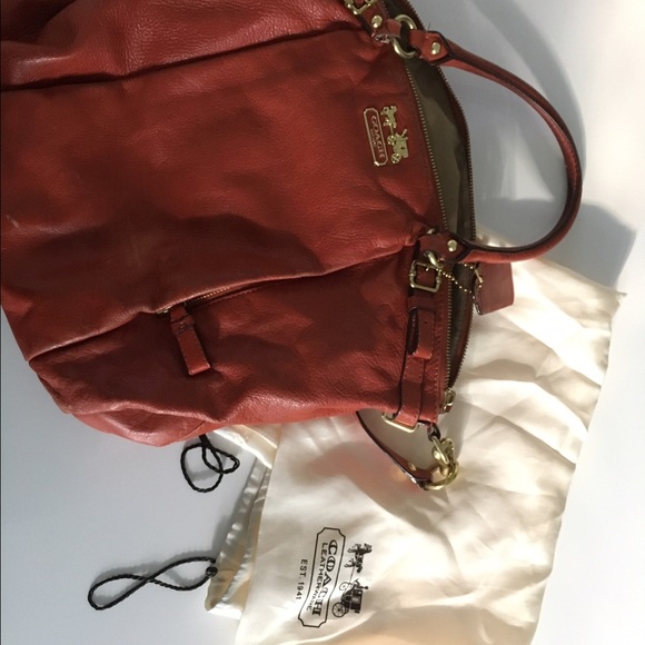 Orange coach handbag with gold hardware