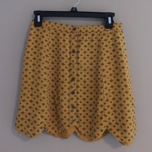 Urban Outfitters yellow scalloped mini skirt