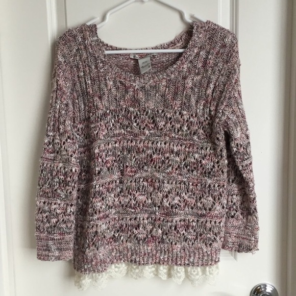 Knit pink/purplish/white/beige sweater with lace.
