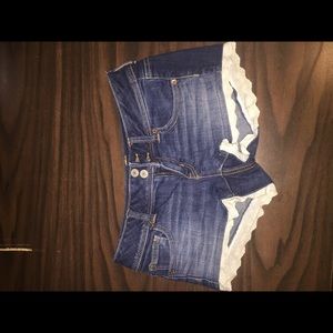 Denim shorts with lace trim