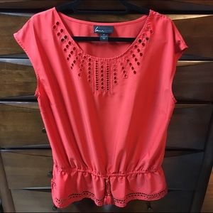 Red blouse with gathered waist.