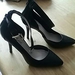 Black ankle strap zip back pumps