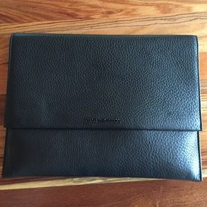 Burberry black leather clutch.