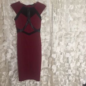 Maroon With black accents dress.