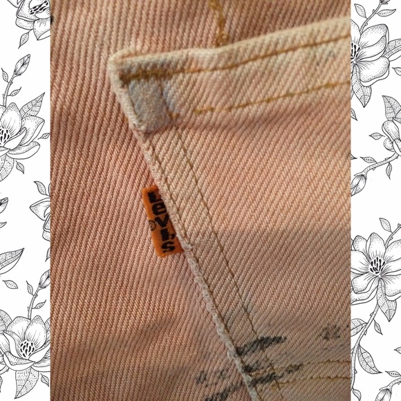 Distressed pink high-waisted Levi's shorts. - Picture 3 of 3