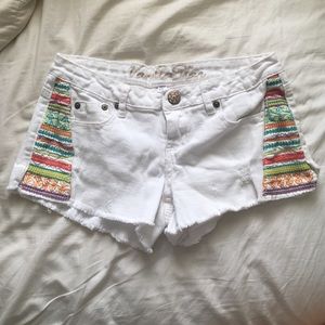 white distressed shorts w/ colorful sewn design