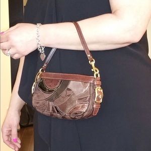 Brown leather Coach wristlet